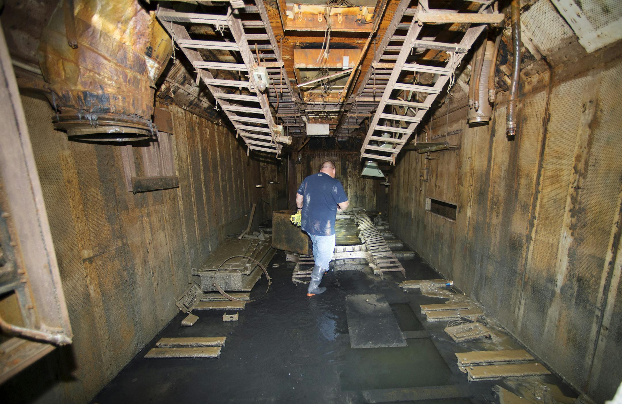 Jamie Creighton of Action Environmental walks inside the Launch Control Center to see what remains. Creighton's father served in the Air Force and worked in Launch Control Centers. (Joe Ledford/The Kansas City Star/TNS)