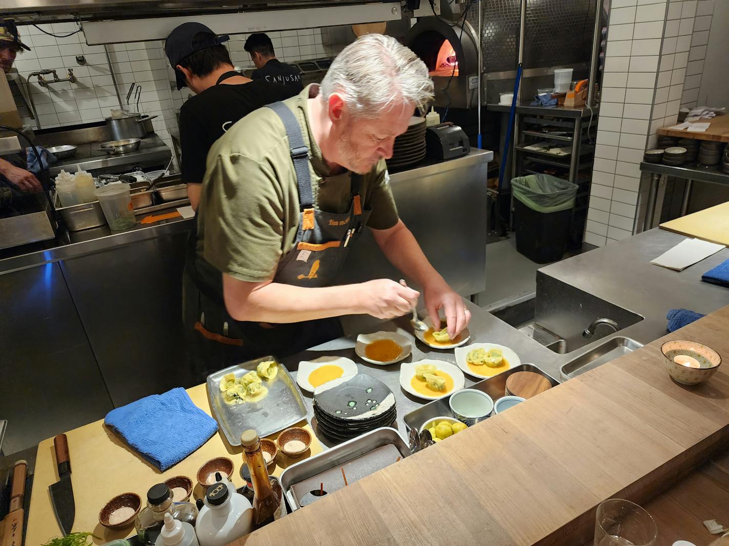 Chef Tim McKee plates a course for his exclusive omakase dinner in Sanjusan's open kitchen.