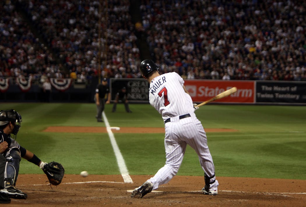 Twins catcher Joe Mauer struck out during fourth inning action in Game 3 of the 2009 ALDS at the Metrodome.