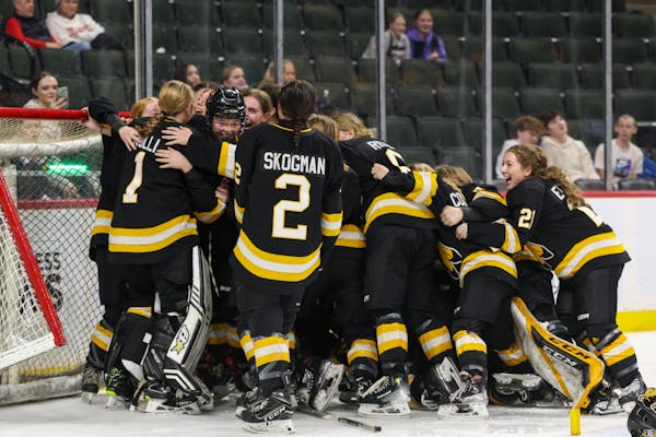 Warroad players knocked over the net and each other as they celebrated their third straight Class 1A title Saturday.