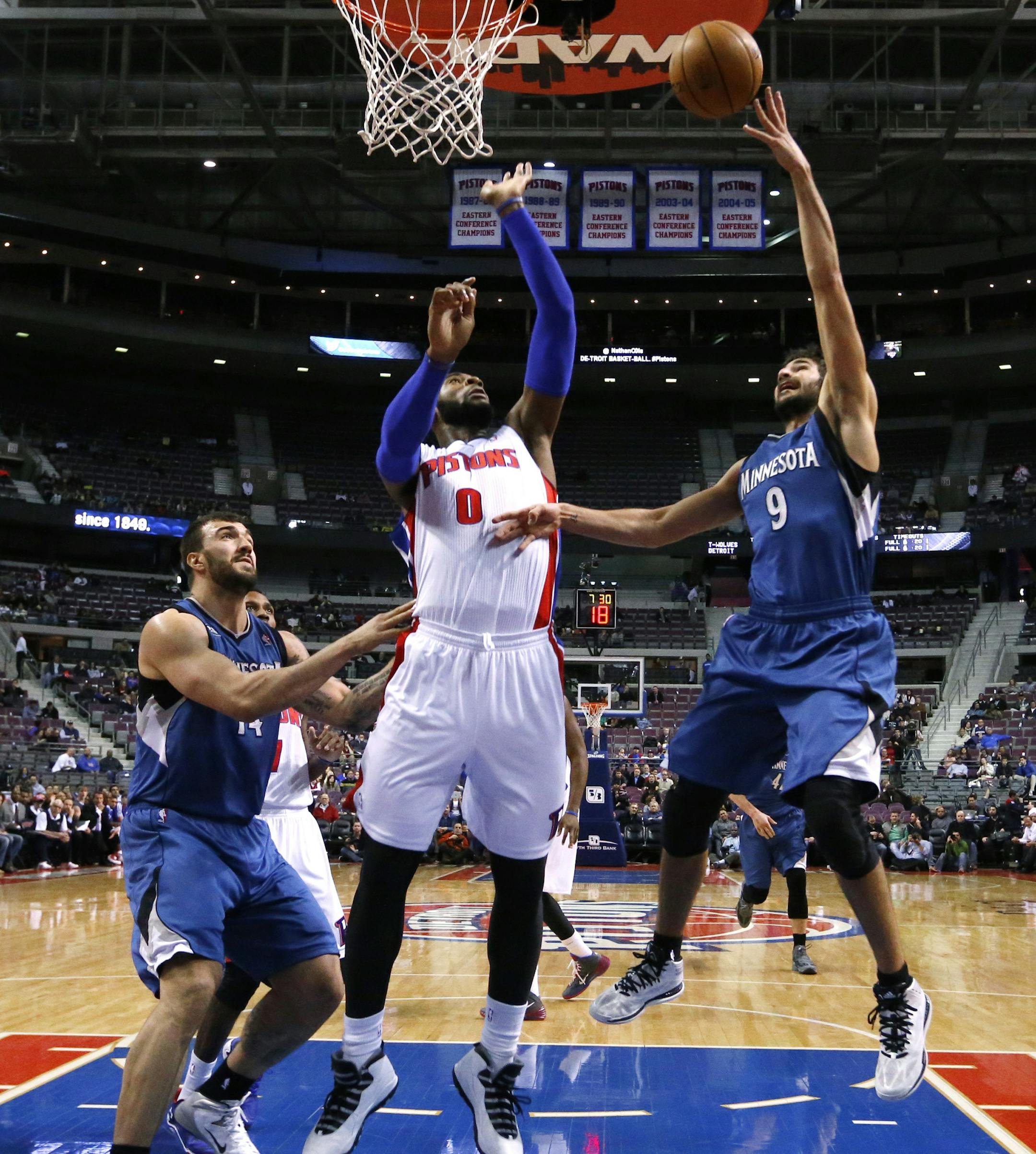 Minnesota Timberwolves point guard Ricky Rubio (9) shoots over Detroit Pistons center Andre Drummond (0) in the first half of an NBA basketball game in Auburn Hills, Mich., Tuesday, Dec. 10, 2013. (AP Photo/Paul Sancya) ORG XMIT: MIN2013121021213000