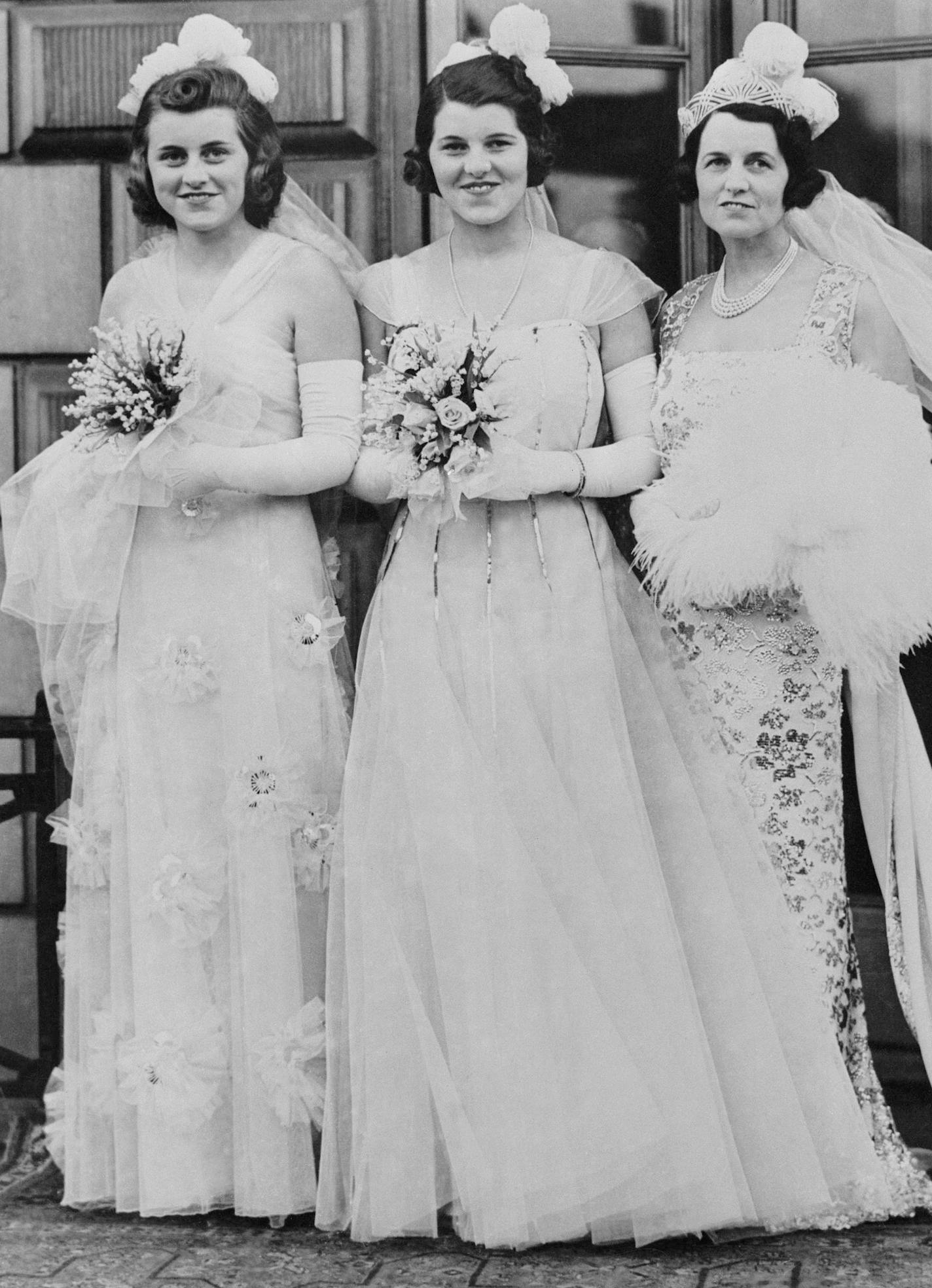 Mrs. Joseph P. Kennedy, wife of the American Ambassador to London, with two of her daughters whom she presented with five other debutantes to the king and queen of England at Buckingham Palace at the first court of the season in 1938. They were photographed before leaving their London home at Princes Gate for the palace on May 17, 1938. Left to right: Miss Kathleen Kennedy, Miss Rosemary Kennedy and Mrs. Rose Kennedy. (AP Photo) ORG XMIT: APHS153348