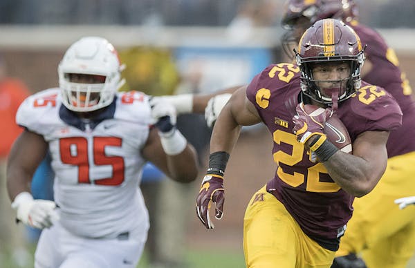 Minnesota's running back Kobe McCrary ran with the ball during the third quarter the Gophers took on Illinois at TCF Bank Stadium, Saturday, October 2