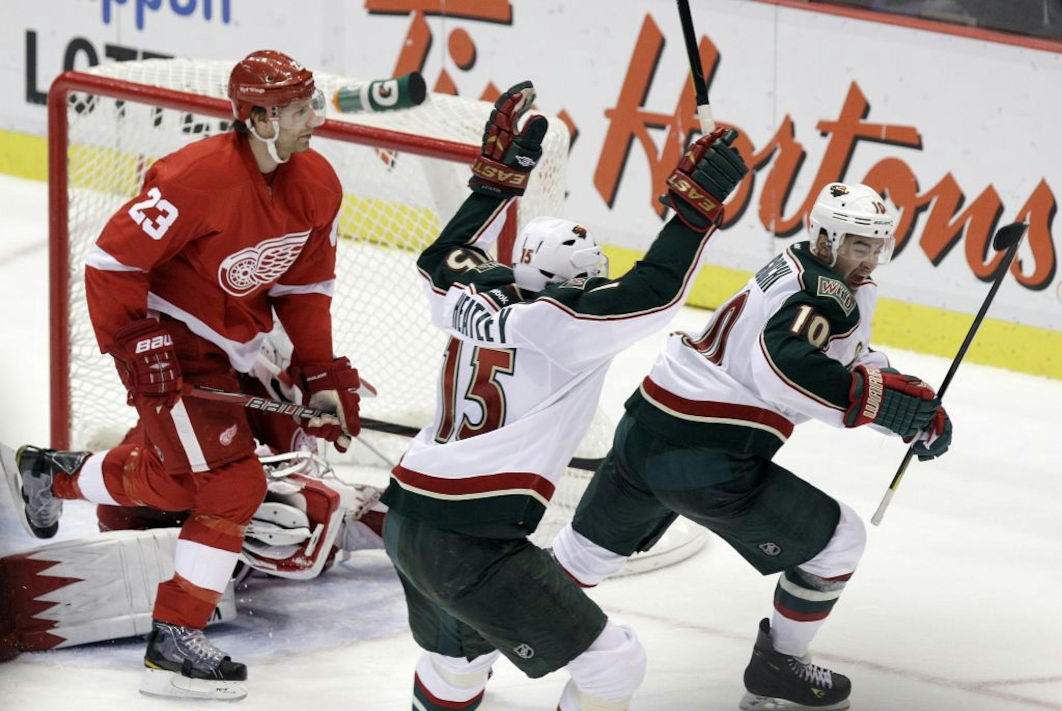 Dany Heatley (15) and Devin Setoguchi (right) were two key acquisitions the Wild made from the San Jose Sharks in the offseason.