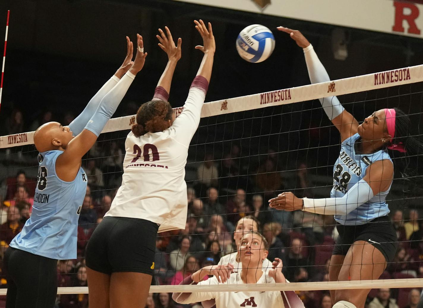 Athletes Unlimited Deja McClendon(18) and U of M player Arica Davis(20) go up to block Athletes Unlimited player Taylor Reid(28) in Minneapolis, Minn., on Tuesday, April 4, 2023. The Gophers play an exhibition game against a professional outfit called Athletes Unlimited at Maturi Pavilion.] RICHARD TSONG-TAATARII • richard.tsong-taatarii @startribune.com