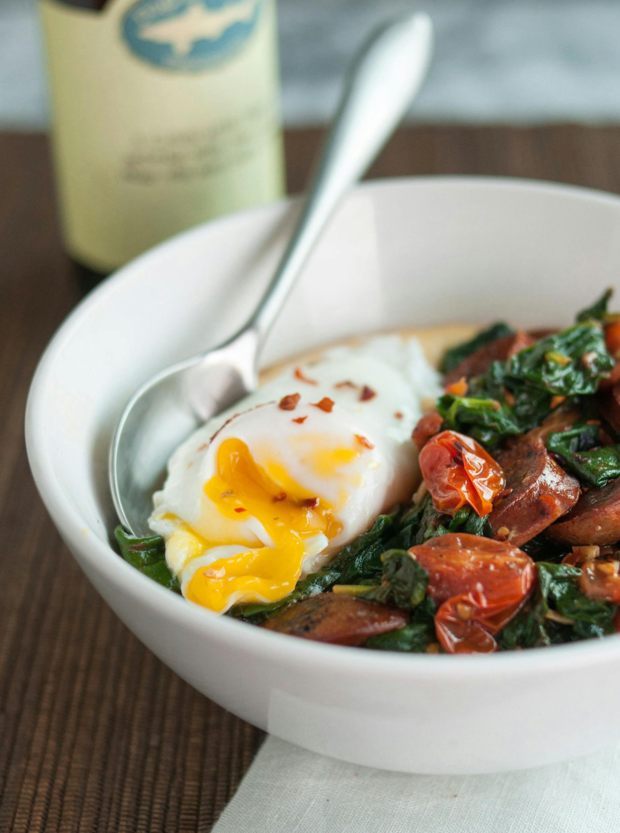 Emma Christianson Polenta Bowl with Garlicky Spinach, Chicken Sausage and Poached Egg. ORG XMIT: tms20140226181427