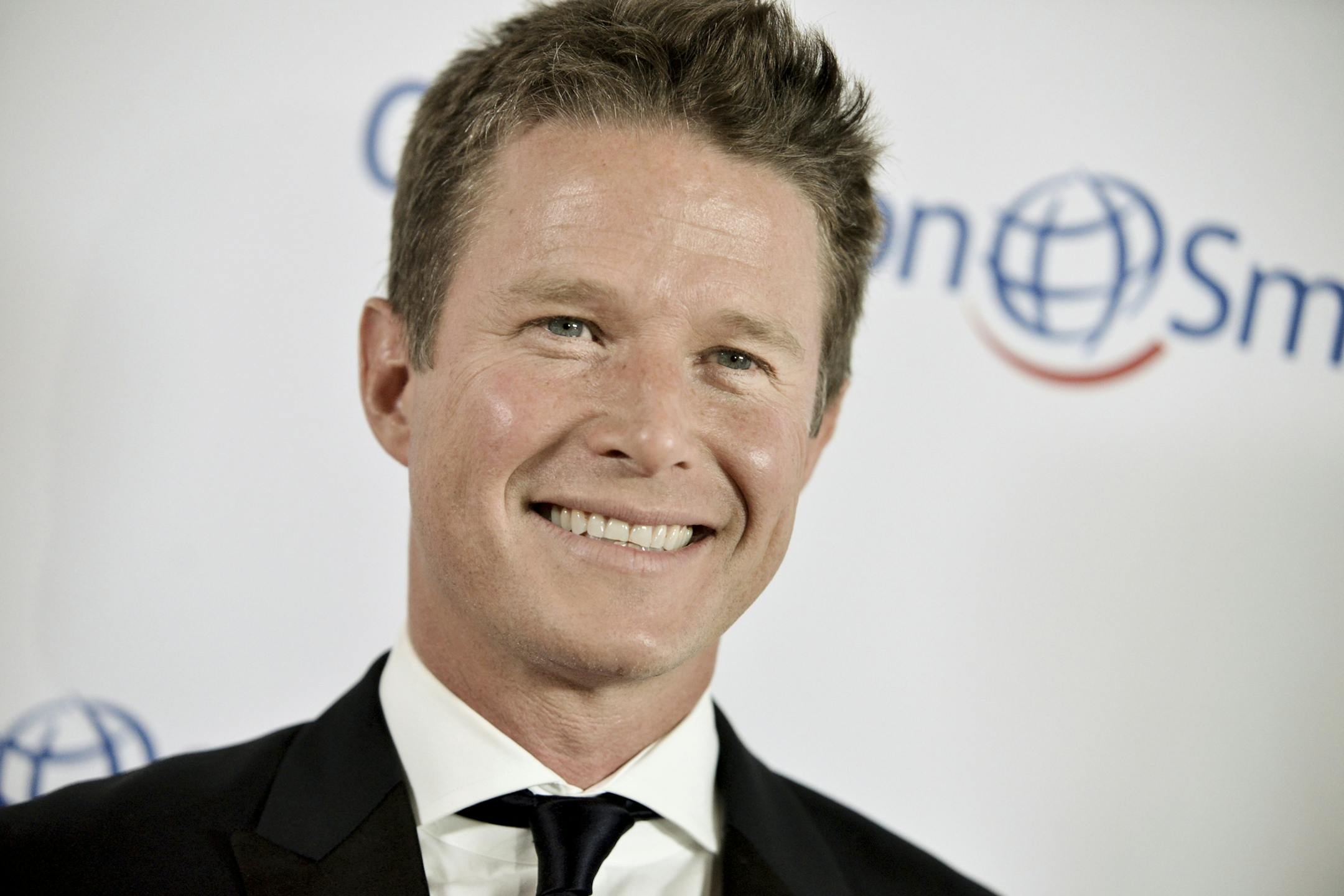 FILE - In this Sept. 19, 2014 file photo, Billy Bush arrives at the Operation Smile's 2014 Smile Gala in Beverly Hills, Calif. Bush, who was fired after an old video emerged of him engaging in offensive sex talk with then “Apprentice” host Donald Trump, says he’s a better man now and ready to get back into television. In an interview posted Sunday, May 21, 2017, Bush told The Hollywood Reporter the past seven months have “been a roller coaster” beginning with s