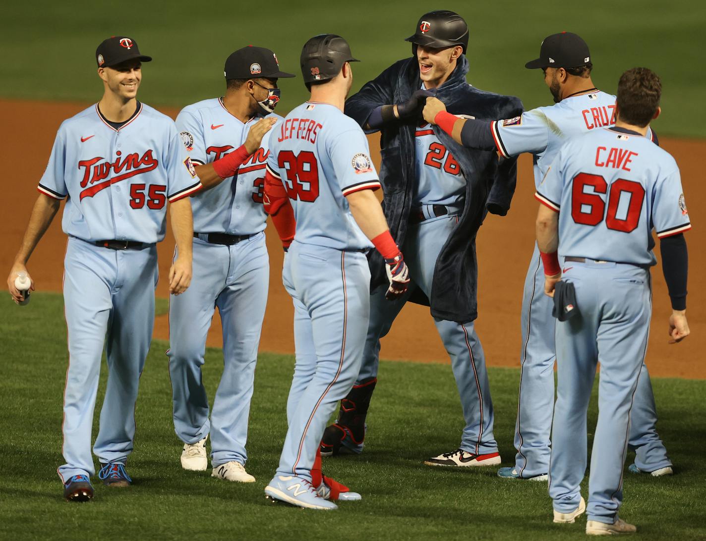 Twins designated hitter Nelson Cruz put his Twins-embroidered bath robe on right fielder Max Kepler after Kepler's late-inning heroics Tuesday night at Target Field.