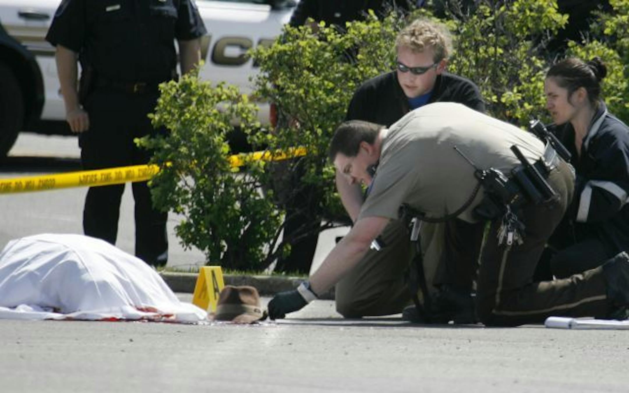 Investigators on the scene of a shooting in Columbia Heights Saturday morning