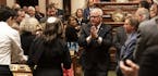 Governor Tim Walz gestured to thank the audience as he left the State of the State Address at the State Capitol in St. Paul, Minn., on Wednesday, Apri