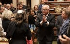 Governor Tim Walz gestured to thank the audience as he left the State of the State Address at the State Capitol in St. Paul, Minn., on Wednesday, Apri