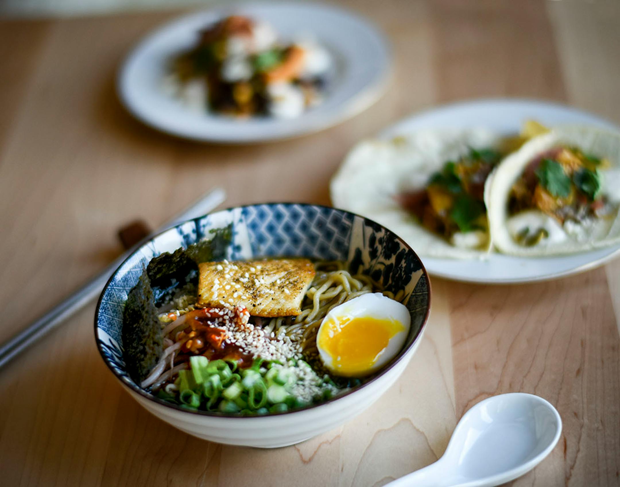 Martha's Daughter's ramen as well as the chicken tacos, right, and corn cake, back.
