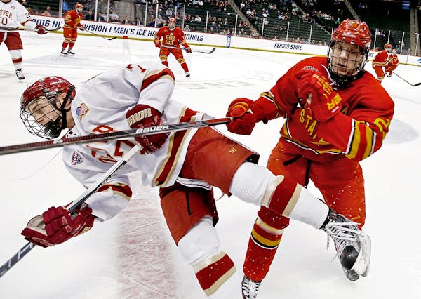 Dylan Gambrell (7) of Denver collided with Brandon Anselmini (23) of Ferris State in the first period.