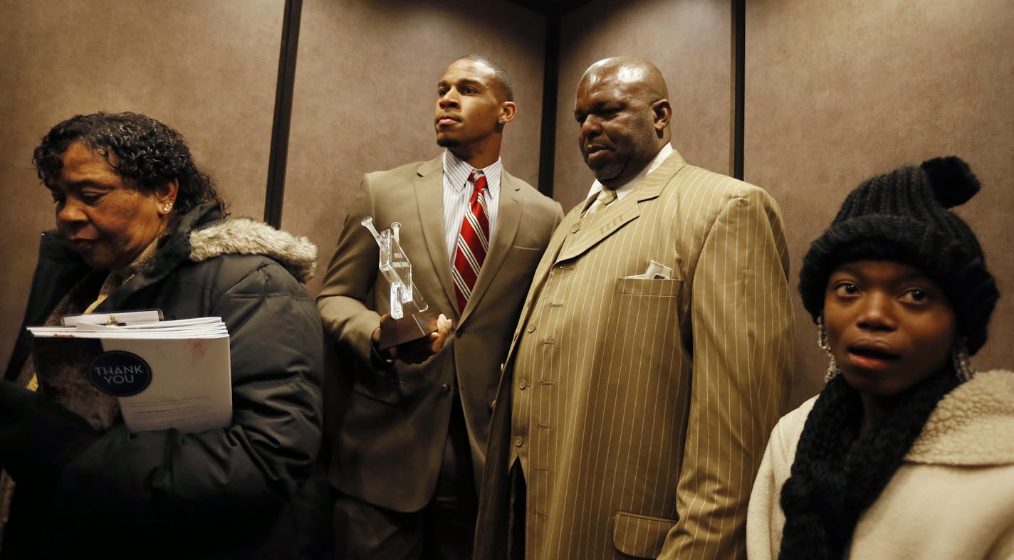 Byron Buxton with his parents Felton and Carrie Buxton and sister Keva waited on and elevator as they walked through the skyway after the Diamond Awards Friday night January 24, 2014 at Target Field in Minneapolis ,MN. Buxton was named minor league player of the year. ] JERRY HOLT &#x201a;&#xc4;&#xa2; jerry.holt@startribune.com ORG XMIT: MIN1402041520211186