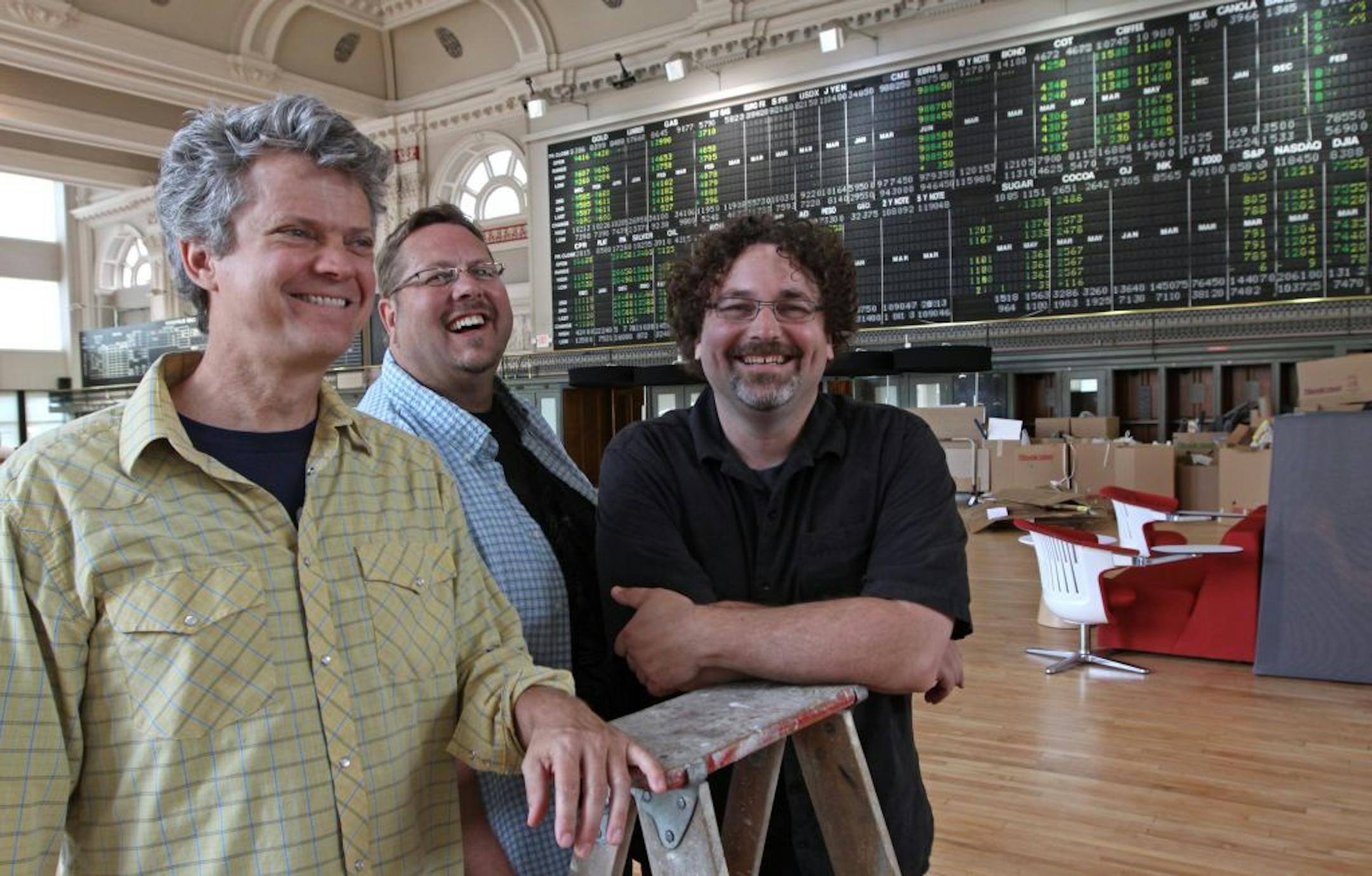 (left to right) Chris Dykstra, Lee Rogas and Mike Milkovich are the founders of Warecorp, a Twin Cities website and IT firm that uses only programmers based in Belarus, a spin-off country of the former USSR. They were photographed July 13th, 2011 in the former Grain Exchange trading floor that will house their new offices.