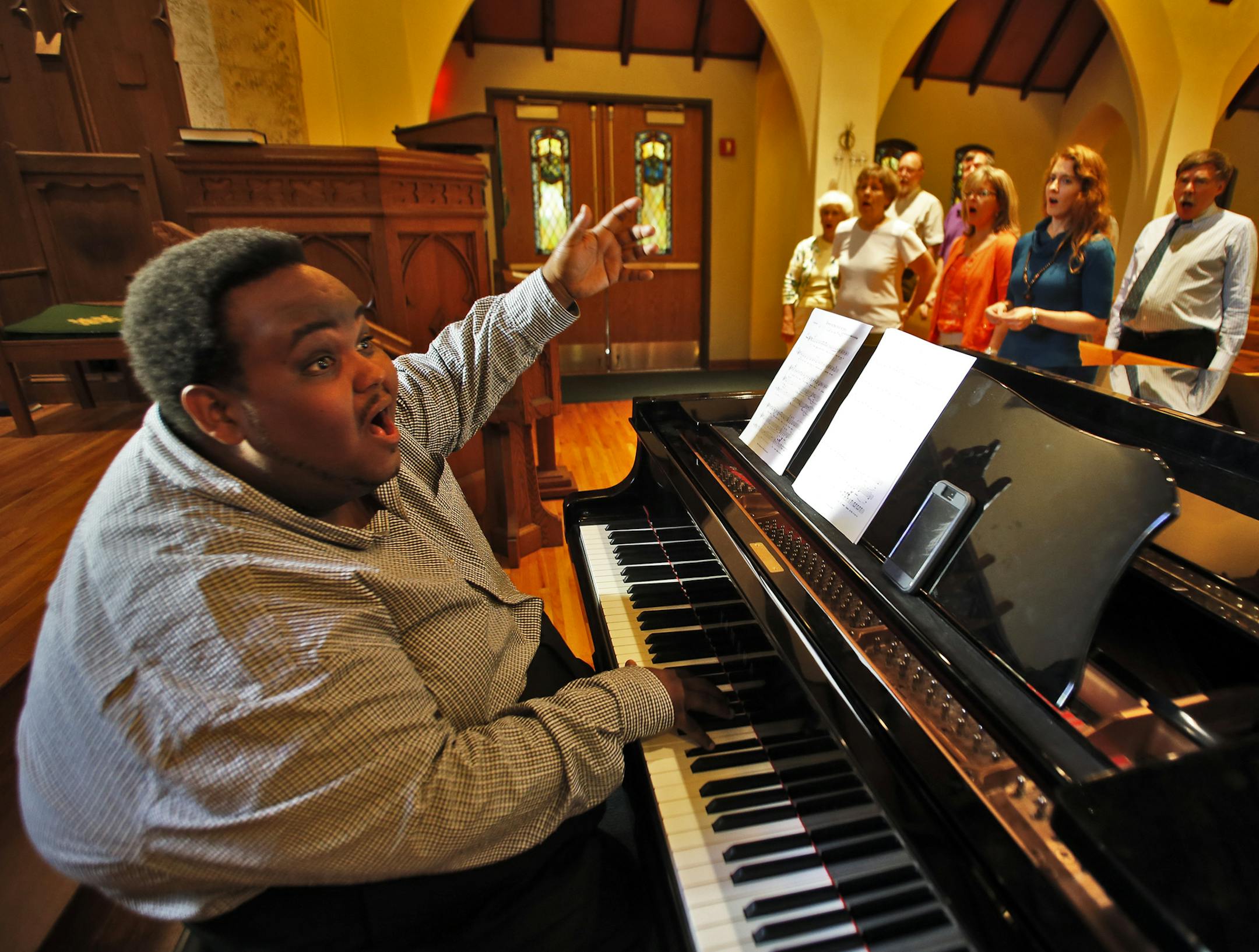 The many expressions of Tesfa Wondemagegnehu in a rehearsal with the Bethlehem Covenant Church choir. ] (MARLIN LEVISON/STARTRIBUNE(mlevison@startribune.com)