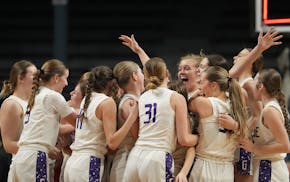 Goodhue players gather Saturday at Williams Arena to enjoy their Class 1A state championship.