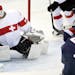 Amanda Kessel (28) shot the puck past Switzerland goalie Florence Schelling (41) in the first period. Kessel had two goals in the game. USA beat Switz