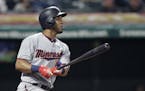 Minnesota Twins' Eddie Rosario watches his double off Cleveland Indians starting pitcher Carlos Carrasco during the fourth inning of a baseball game T