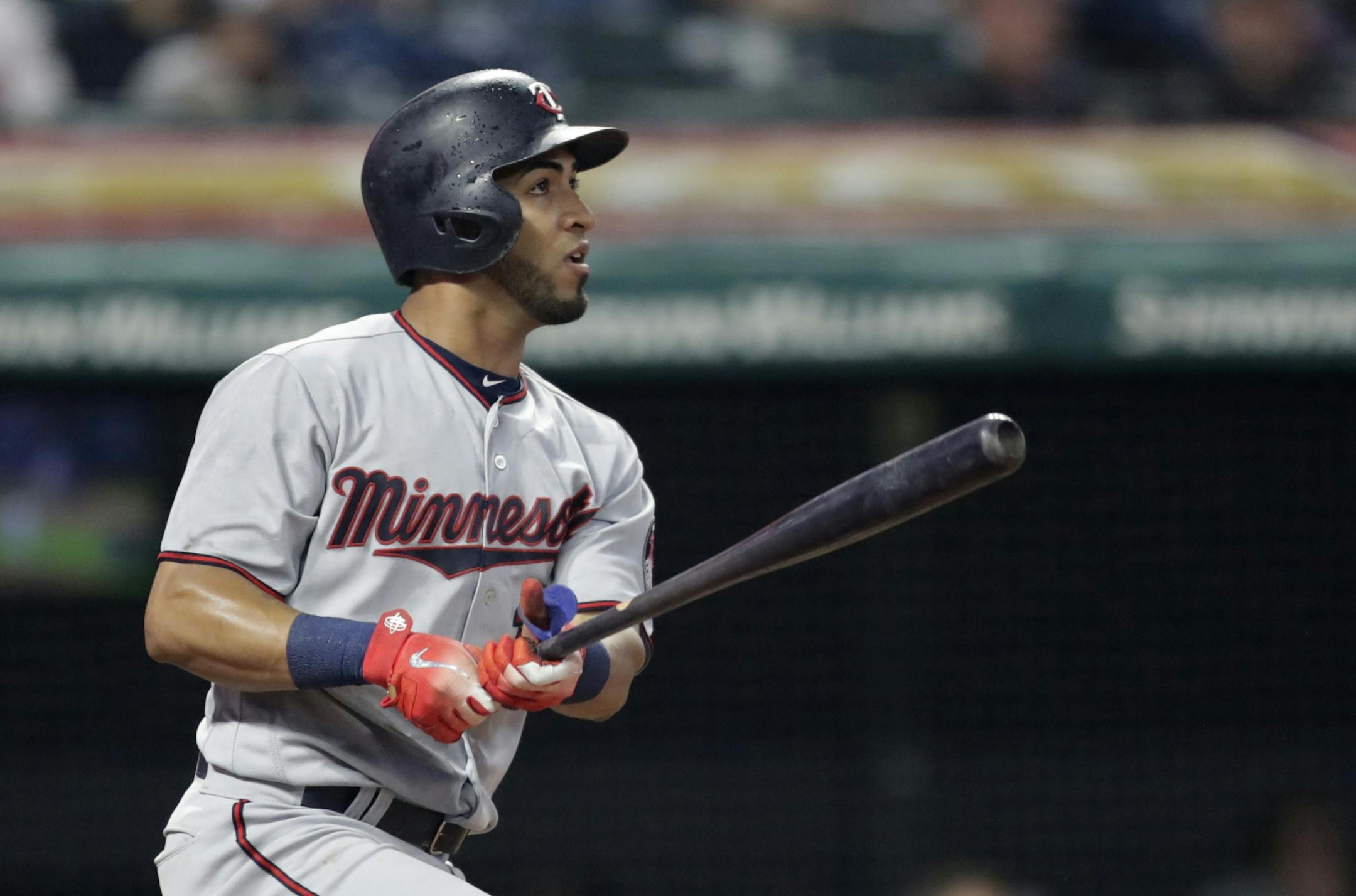 Minnesota Twins' Eddie Rosario watches his double off Cleveland Indians starting pitcher Carlos Carrasco during the fourth inning of a baseball game Tuesday, Aug. 7, 2018, in Cleveland.