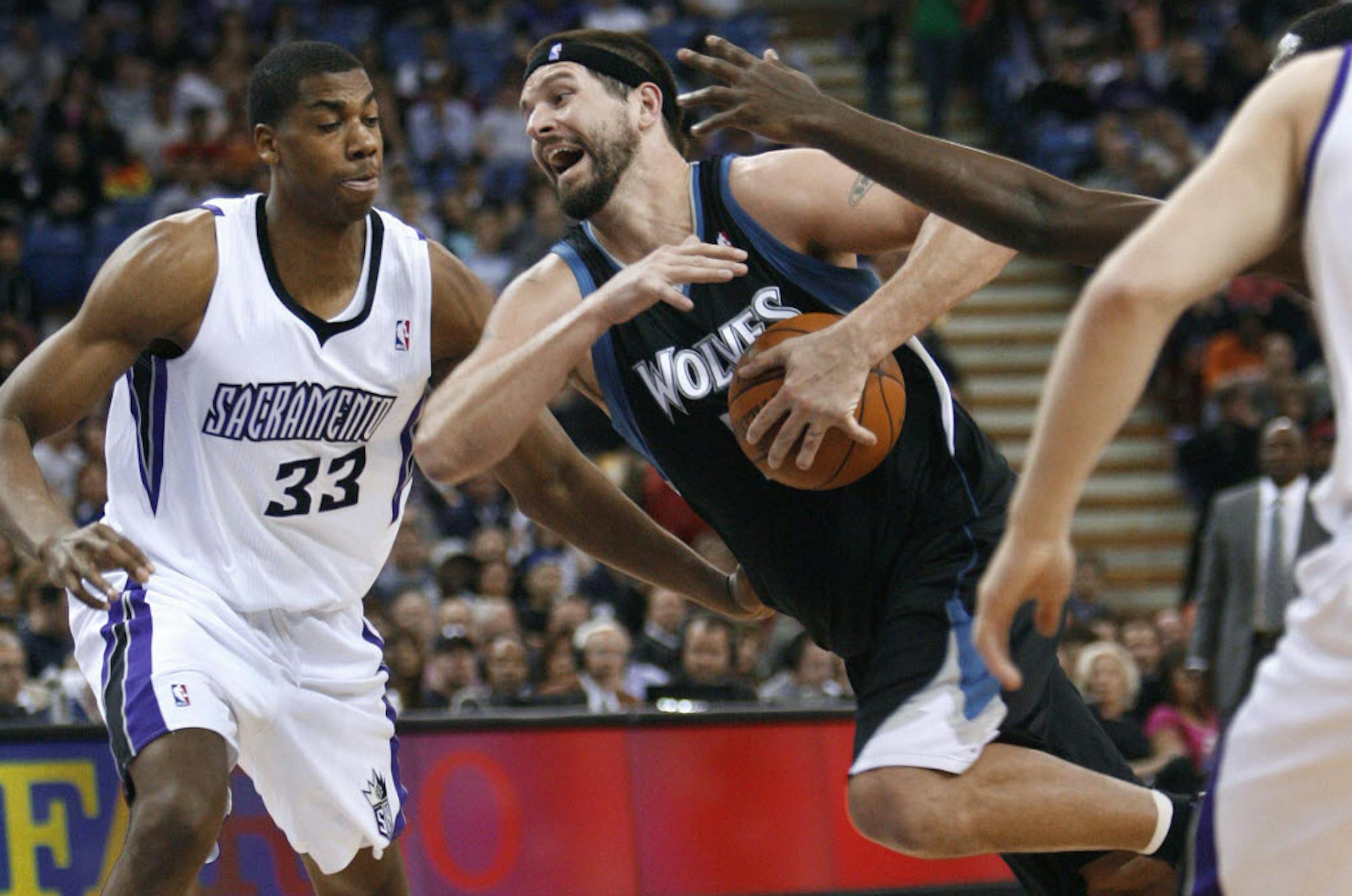 The Wolves' Brad Miller, right, drove the lane against Sacramento's Hassan Whiteside. Whiteside, a 2010 second-round pick released by Sacramento in July, worked out at Target Center on Thursday as team executives looked on.
