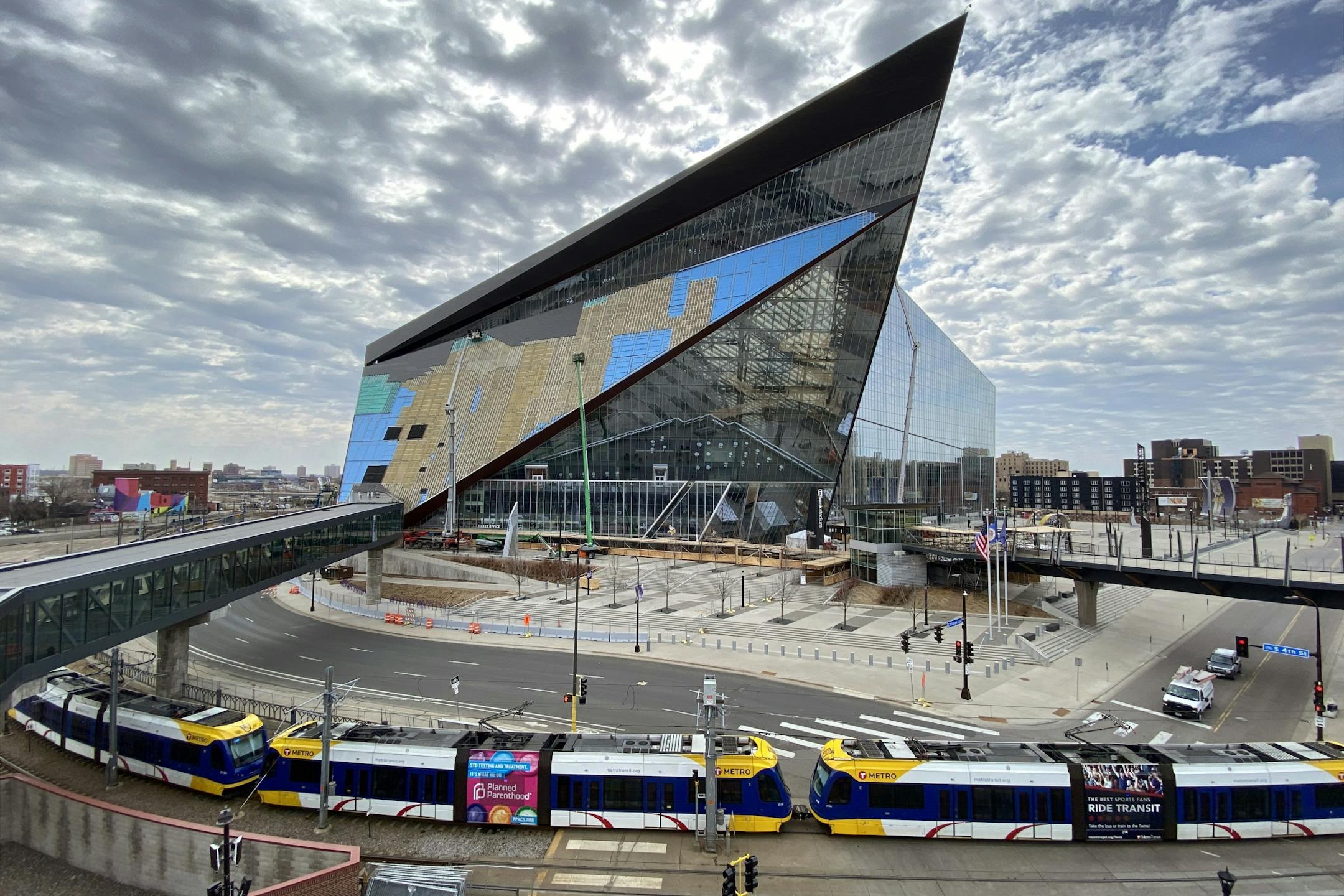 With downtown devoid of people due to Gov. Tim Walz 'Stay at Home' order to fight the Coronavirus pandemic crews worked quickly to remove and replace the outer layers of U.S. Bank Stadium Thursday.