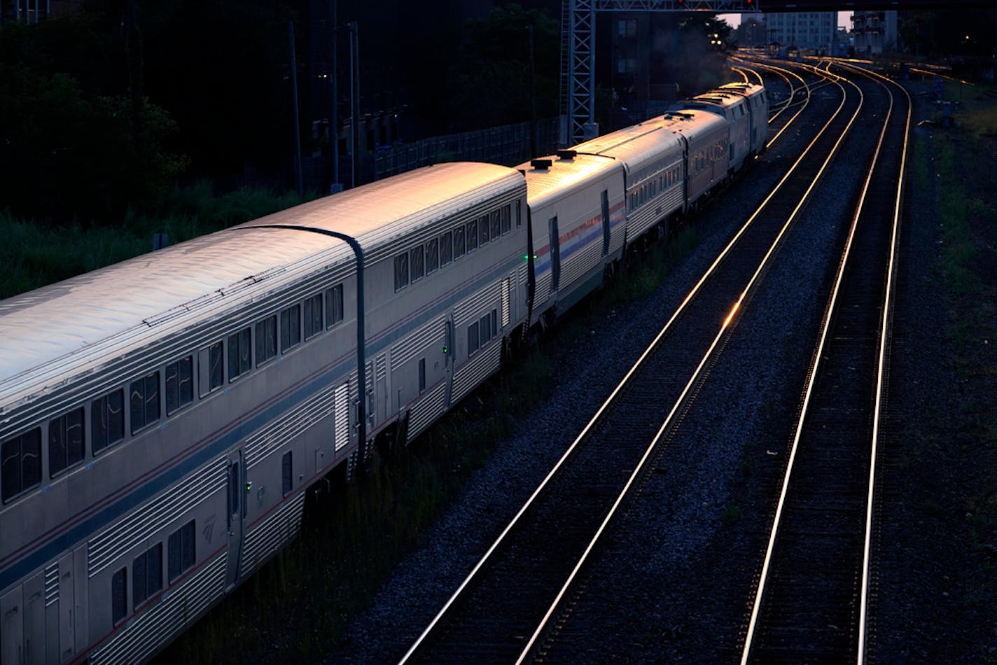 An Amtrak passenger train sits near Chicago's Union Station in the evening Wednesday, Sept. 14, 2022. (AP Photo/Charles Rex Arbogast)