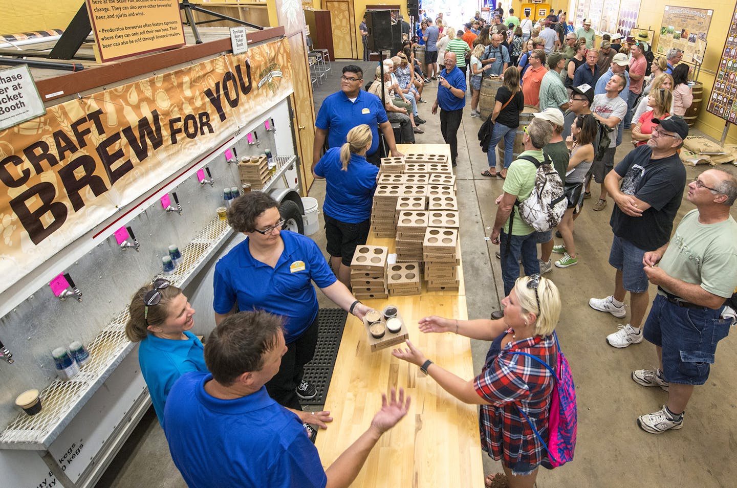 Fairgoers enjoyed flights of beer at the Minnesota Craft Brewers Guild exhibit at the State Fair in 2016.