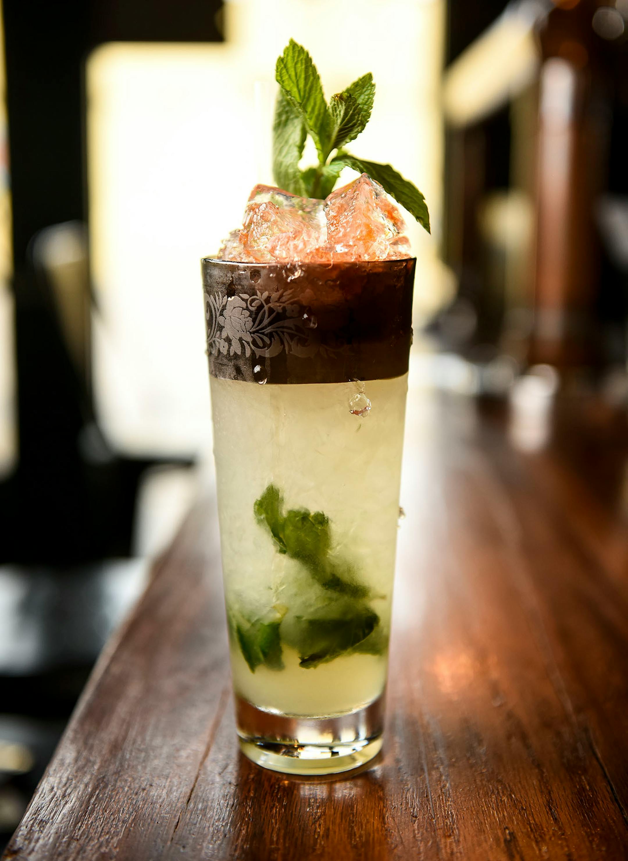 Vikre Distillery's Pikku Swizzle with Boreal Cedar Gin, garden liqueur, lime, mint and Angostura bitters.