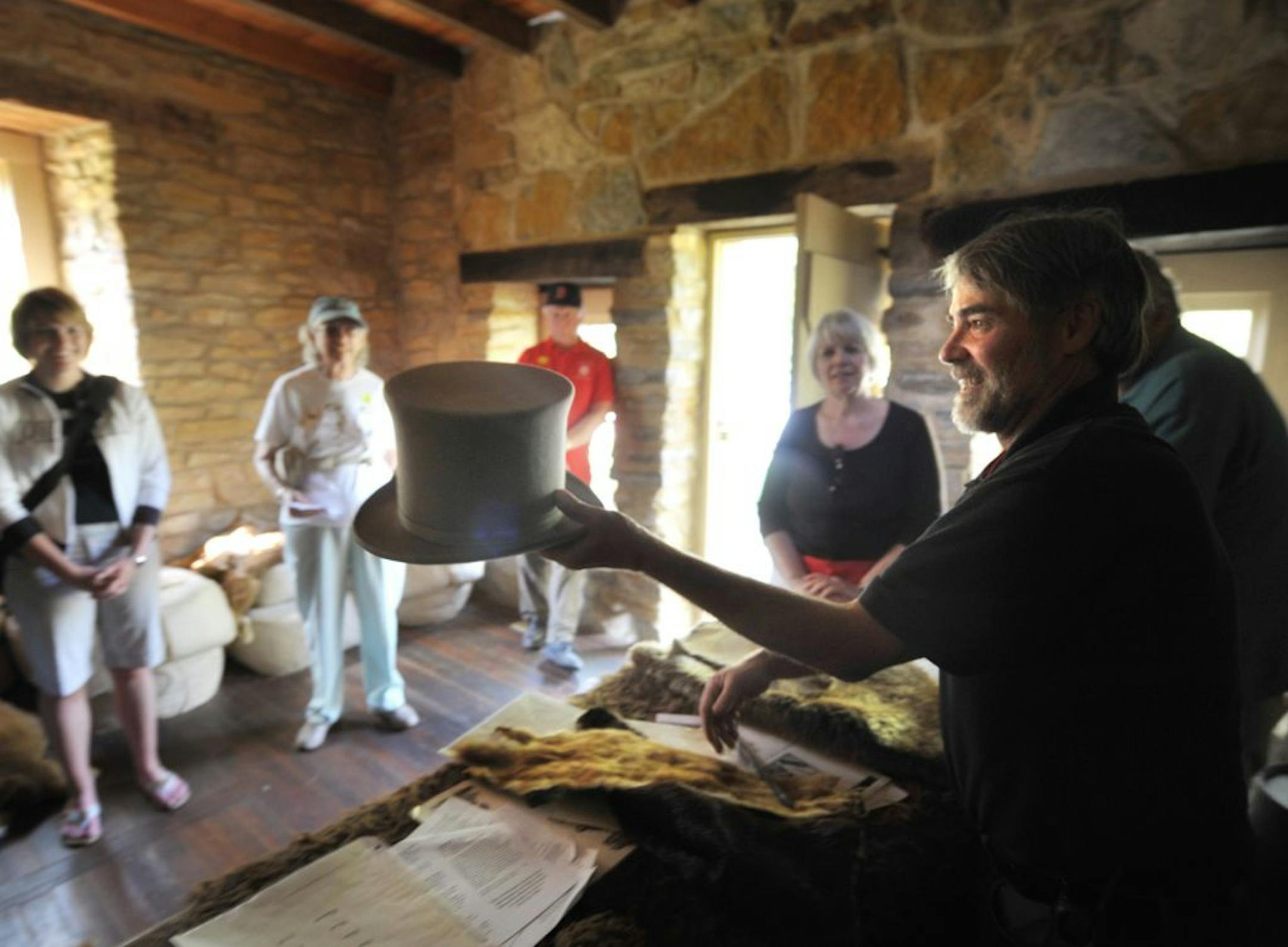 During a tour of the Sibley House historic site, Wesley Stone showed off a beaver hat like one that could have been worn by Henry Sibley during a tour of the Cold Store, where fur trappers traded their furs for dry goods.