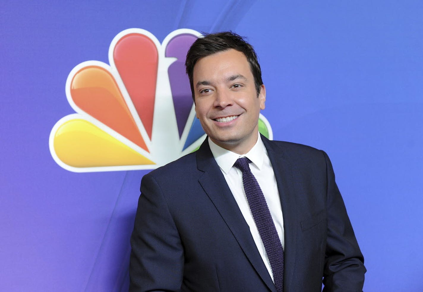 FILE - In this May 12, 2014 file photo, "The Tonight Show" host Jimmy Fallon attends the NBC Network 2014 Upfront presentation at the Javits Center in New York. Fallons told The Associated Press Wednesday, Feb. 22, 2017, that he donated $100,000 to his high school alma mater, Saugerties High School in upstate New York. (Photo by Evan Agostini/Invision/AP, File)