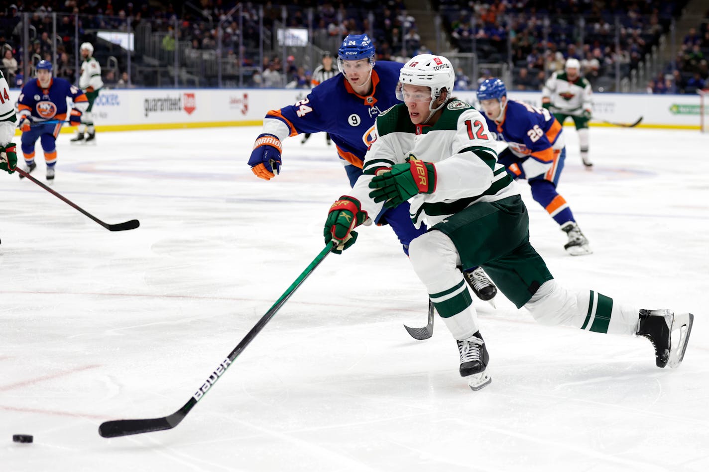 Wild left wing Matt Boldy skates with the puck past New York Islanders defenseman Scott Mayfield in January.