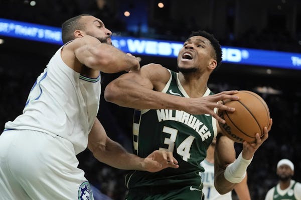 Bucks forward Giannis Antetokounmpo tried to get past Timberwolves center Rudy Gobert during the first half of the Wolves' 129-105 victory in Milwauke