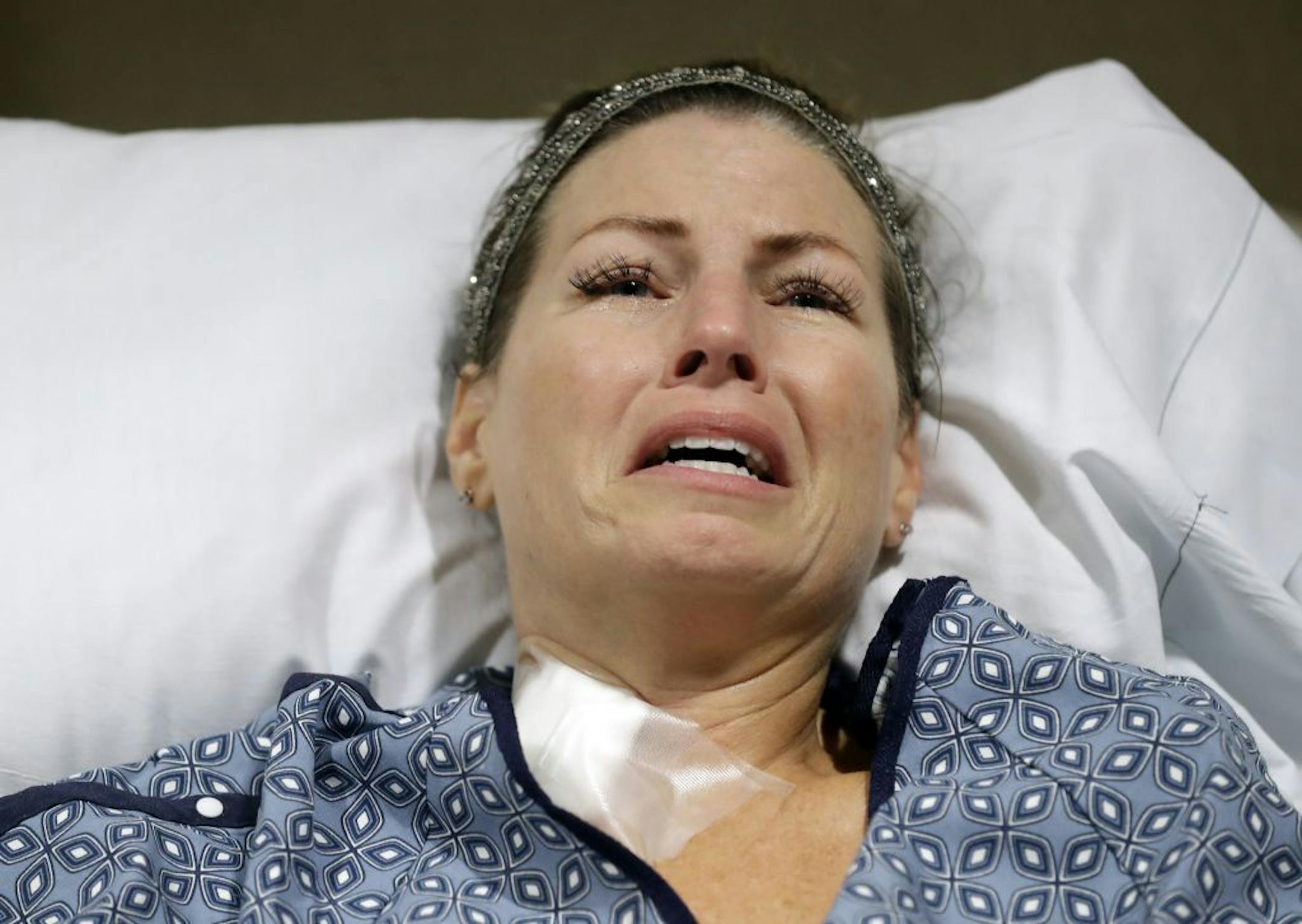 Natalie Vanderstay answers questions from her hospital bed at University Medical Center on Tuesday, Oct. 3, 2017, in Las Vegas. Vanderstay was shot in the stomach, and suffered a leg injury after a gunman opened fire on an outdoor music concert on Sunday.