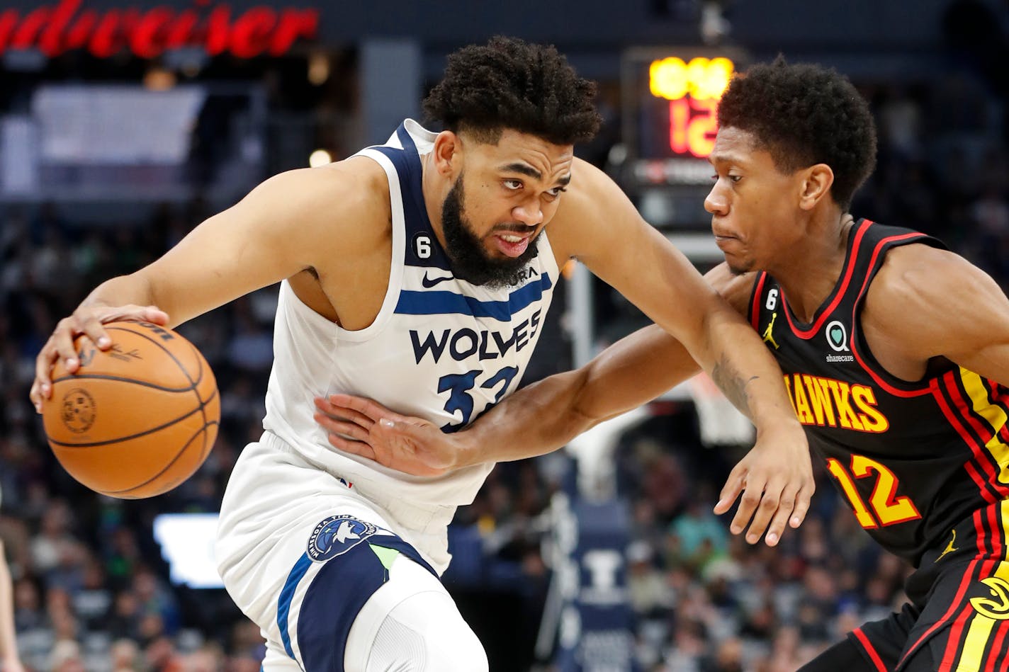 Timberwolves center Karl-Anthony Towns, playing in his first game since November, worked past Hawks forward De'Andre Hunter in the first quarter Wednesday.