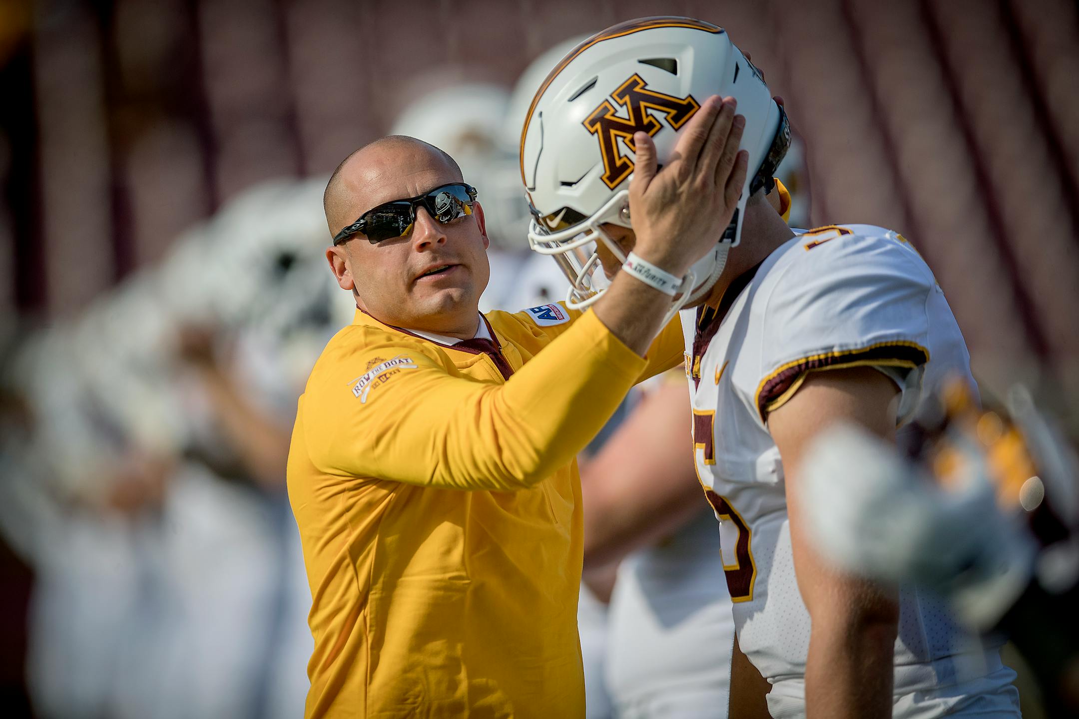 Coach P.J. Fleck greeted quarterback Zack Annexstad before the season-opener