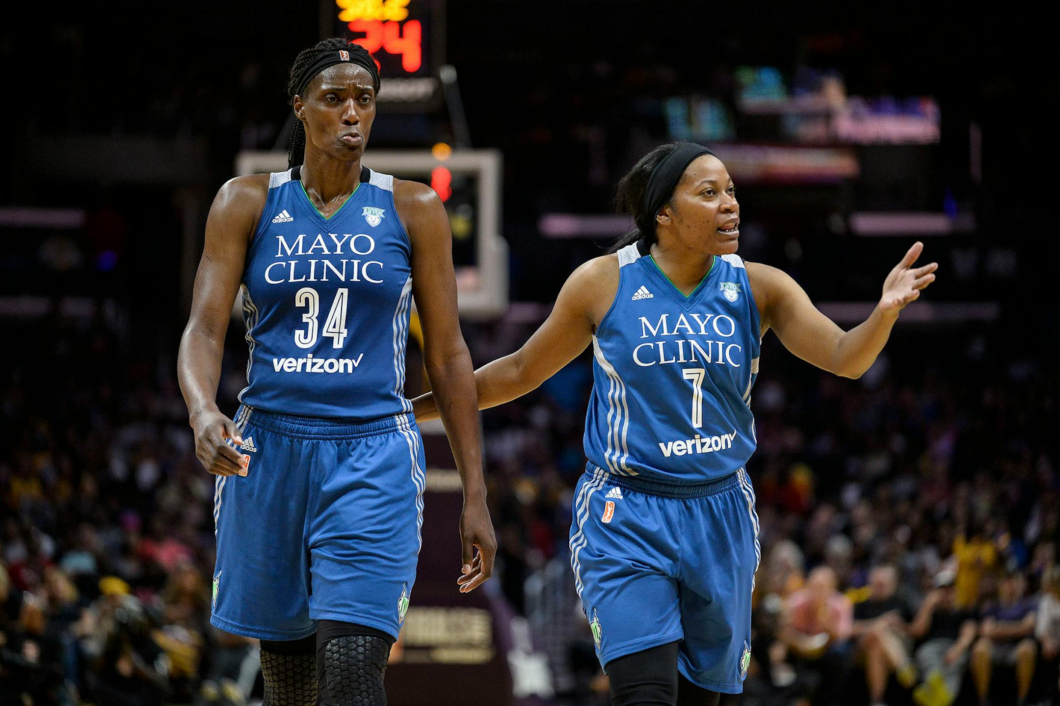 Minnesota Lynx center Sylvia Fowles (34) was in pain as guard Jia Perkins looked to an official for a foul call after Fowles was cut on her nose during a rebound attempt Sunday in the second half.