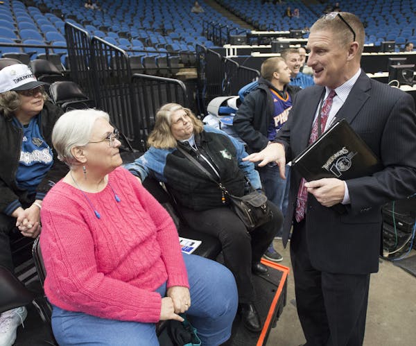 Jeff Munneke, Minnesota Timberwolves Vice President of Fan Experience and the Wolves-Lynx Academy chats with longtime season ticket holders, from left