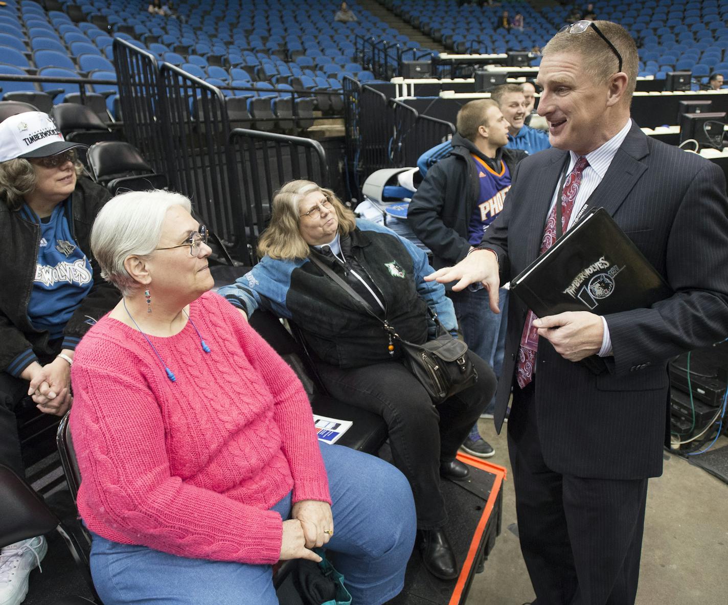 Jeff Munneke, Minnesota Timberwolves Vice President of Fan Experience and the Wolves-Lynx Academy chats with longtime season ticket holders, from left, Laura Kisling, Toni Morgan and Gail Gisling. All three women have held season tickets for more than 10 years, with Morgan in the lead with 26 years. ] (Aaron Lavinsky | StarTribune) The Minnesota Timberwolves play the Phoenix Suns Wednesday, Jan. 7, 2014 at Target Center in Minneapolis. ORG XMIT: MIN1501080017520800