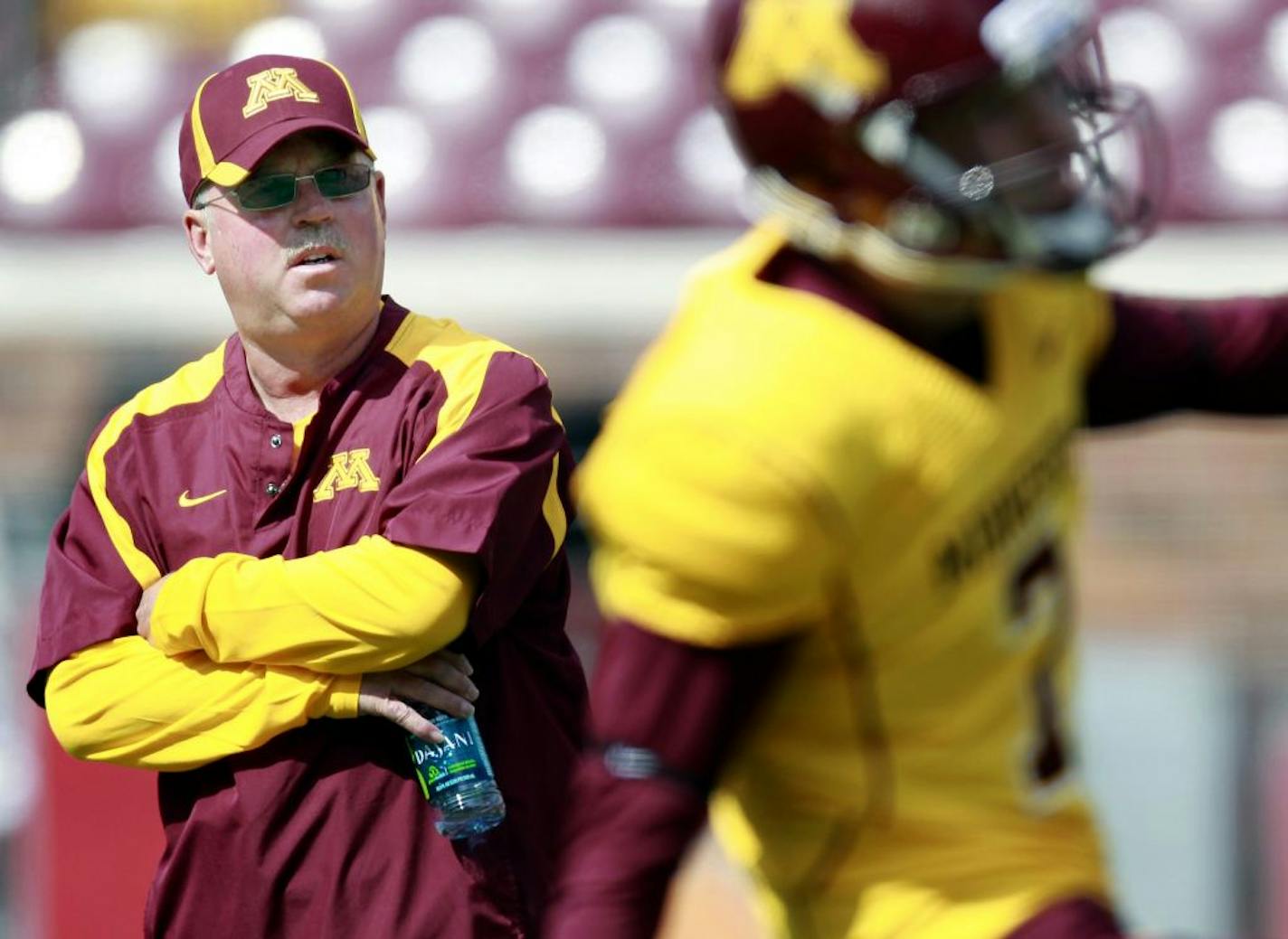 Minnesota head football coach Jerry Kill watched his team at TCF Bank Stadium during team warm ups before Saturday's game.