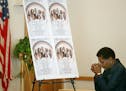 Gwen Fraction, a member of the St. Peter's AME church since 1957, prayed near a collections of photographs of the 9 people that were killed last week 