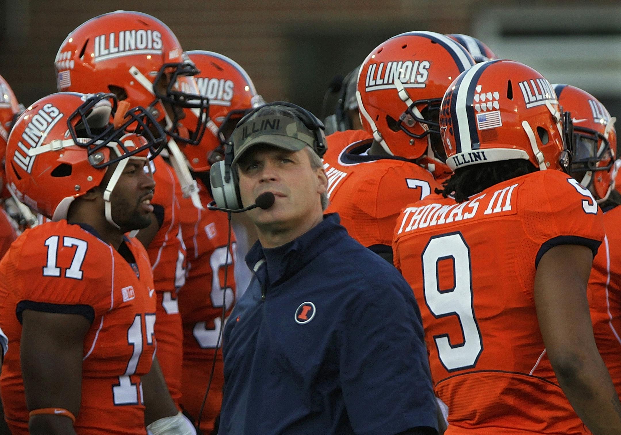 Illinois head coach Tim Beckman, center, looks on during the first half of an NCAA college football game against Minnesota, Saturday, Nov. 10, 2012, in Champaign, Ill. Minnesota defeated Illinois 17-3.