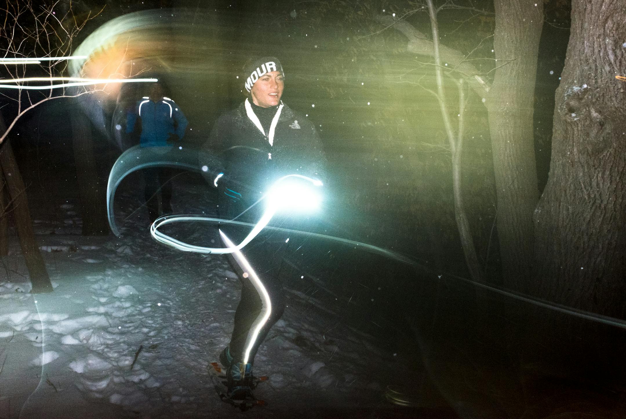 Renee Rivers, of Woodbury, ran though a dark trail in Carver Lake Park. ] Mark Vancleave - mark.vancleave@startribune.com * Runners participated in a night snowshoe run in Carver Lake Park, Woodbury on Wednesday, Jan. 6, 2015.