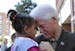 Former President Bill Clinton holds 3-year-old Jakiera Dupree while campaigning for Democratic presidential nominee Hillary Clinton in Wilson, N.C., o