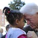 Former President Bill Clinton holds 3-year-old Jakiera Dupree while campaigning for Democratic presidential nominee Hillary Clinton in Wilson, N.C., o