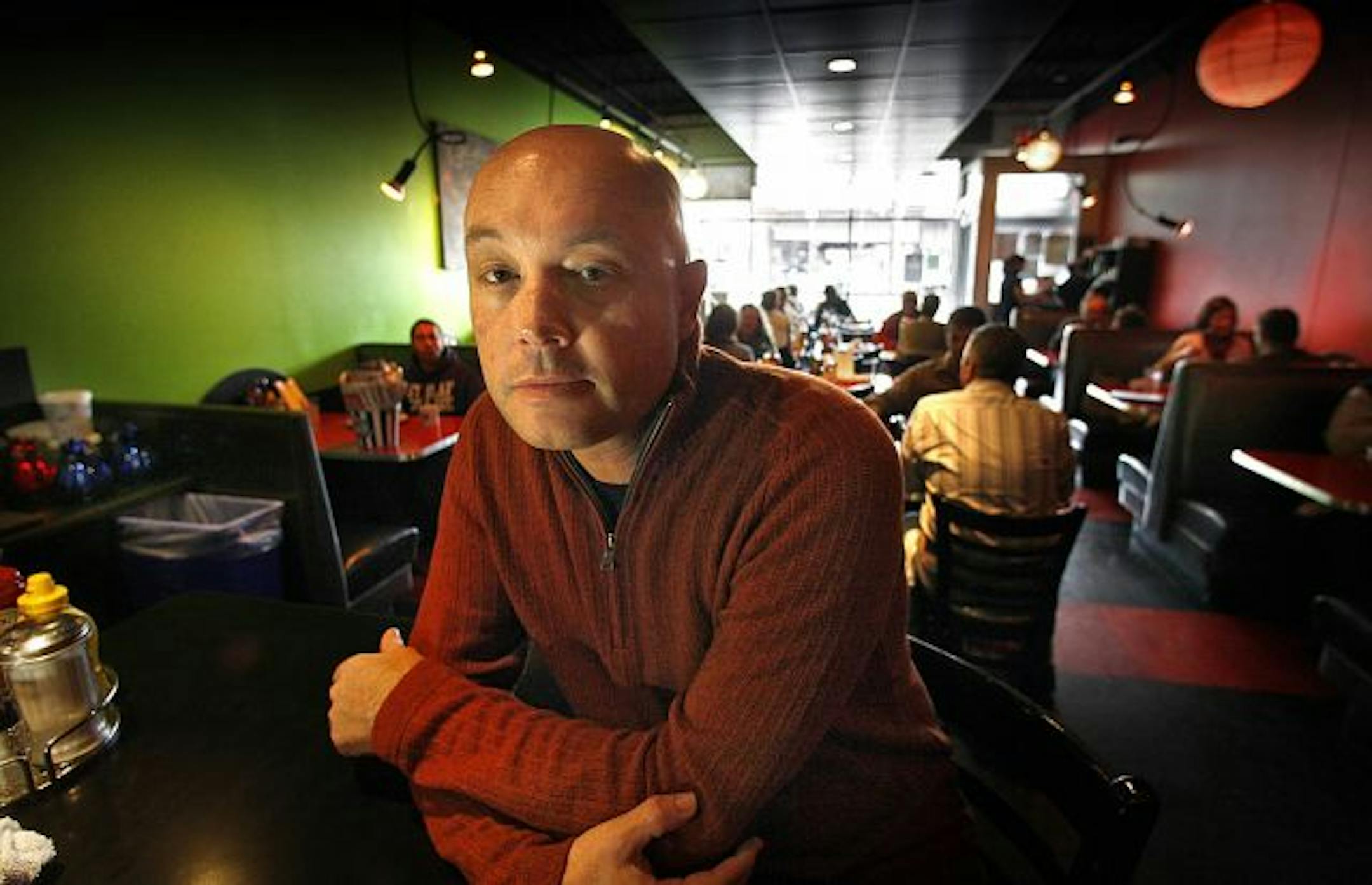 File photo: Blue Plate Restaurant Co. CEO David Burley, standing at the counter of the company's Highland Grill in St. Paul.