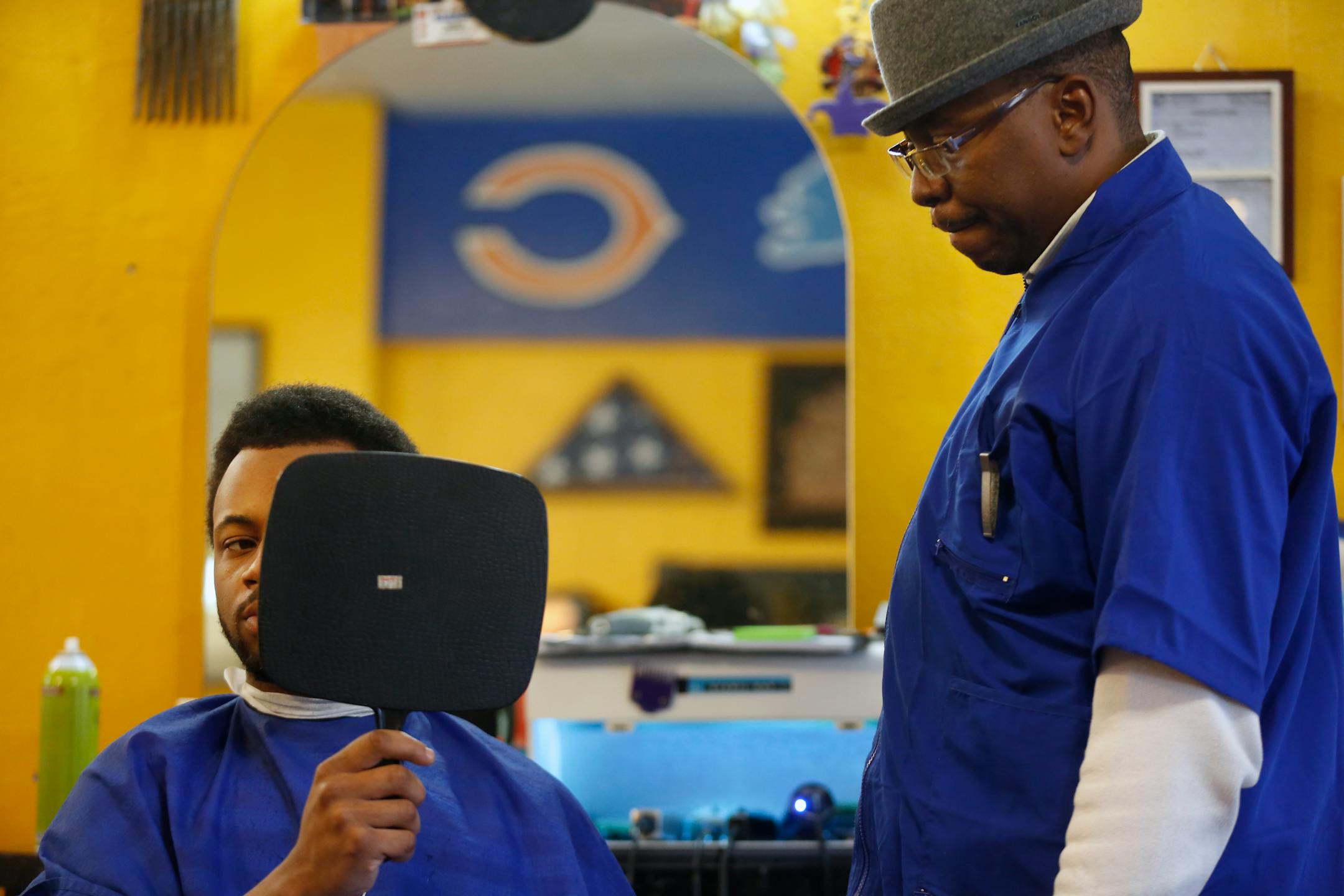 At Brian D's Old School Barbers in north Minneapolis, Dontrel Chew-McIntosh, 21, has been hearing about healthy living and safe sex from owner Brian Davis since he was a teen. He picked up some free condoms after his haircut.