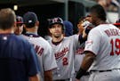Minnesota Twins' Brian Dozier (2) celebrates his solo home run against the Detroit Tigers in the third inning during a baseball game in Detroit, Monda
