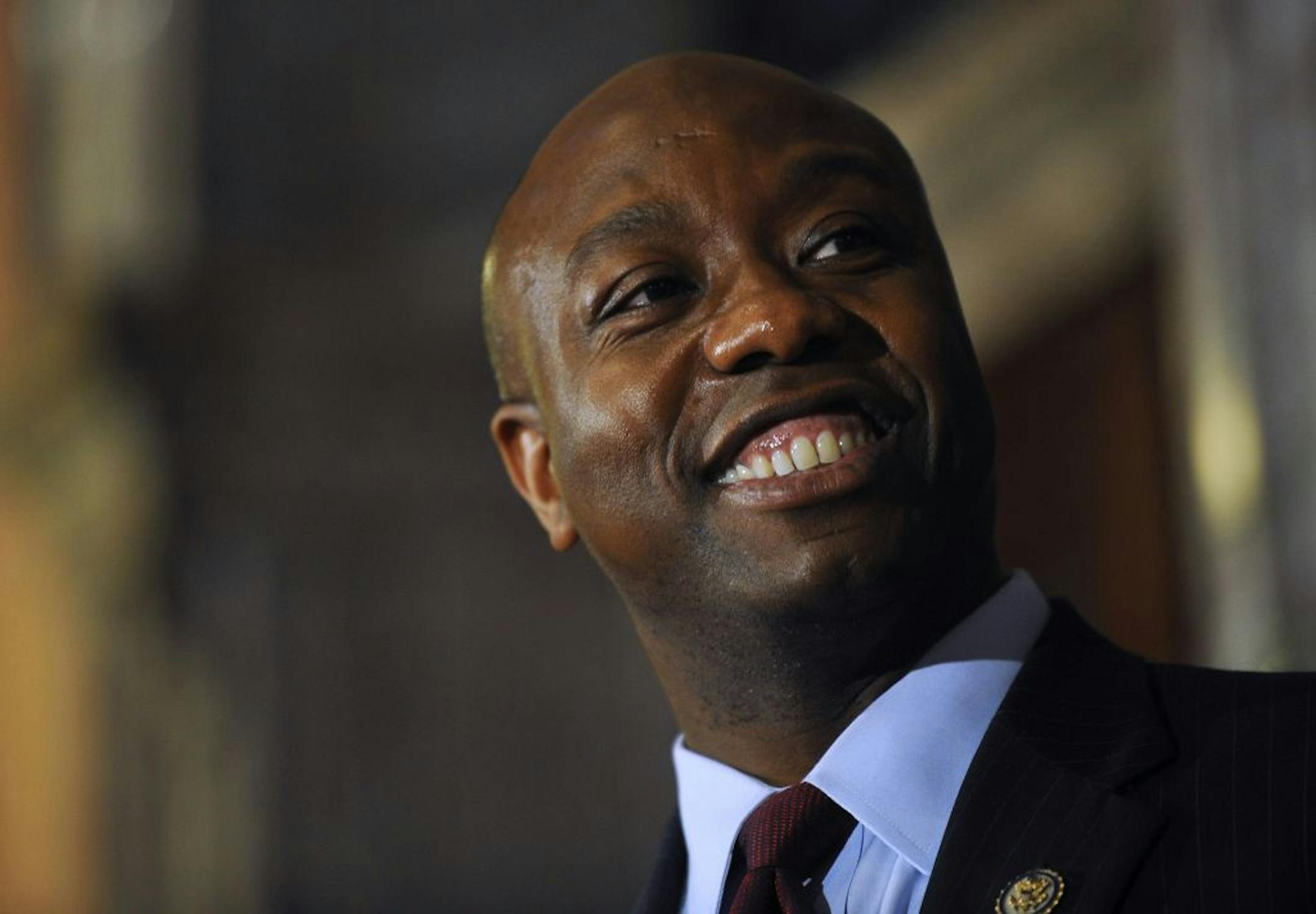 U.S. Rep. Tim Scott smiles during a press conference announcing him as Jim DeMint's replacement in the U.S. Senate at the South Carolina Statehouse on Monday, Dec. 17, 2012, in Columbia, S.C. South Carolina Gov. Nikki Haley announced Scott, as Sen. Jim DeMint's replacement, making him the only black Republican in Congress and the South's first black Republican senator since Reconstruction.