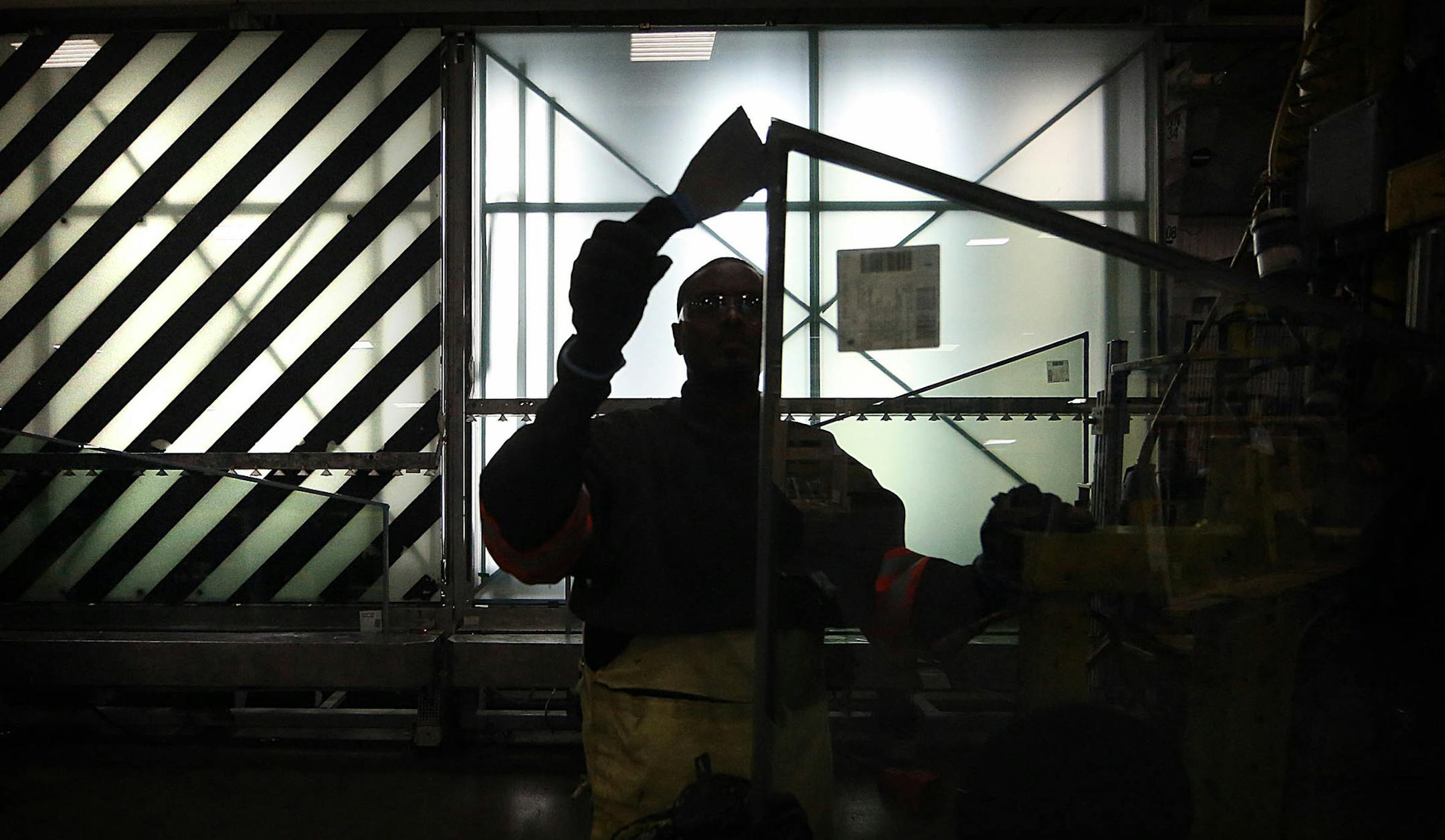 A Viracon worker prepared a panel of glass for shipping the installer for construction of the new Vikings Stadium. ] JIM GEHRZ ï james.gehrz@startribune.com / Owatonna, MN / February 12, 2015 /11:00 AM - BACKGROUND INFORMATION: Glass maker Viracon begins producing the windows for the new Vikings Stadium in February. We have been invited in for a tour. The company CEO will see some of the first windows roll off the production line. The plant is in Owatonna.